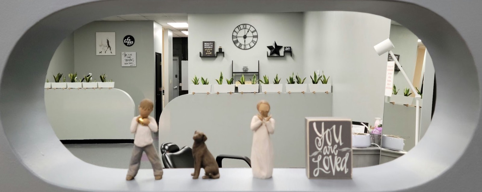The salon floor at Beulah Beauty Boutique, styling stations along one wall